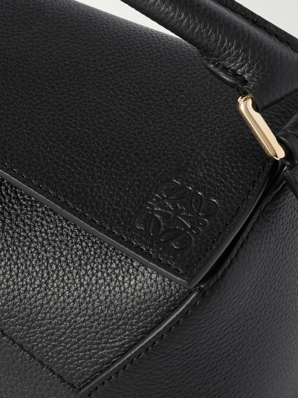 Close-up detail of the Loewe Puzzle Edge Mini Textured-leather Shoulder Bag