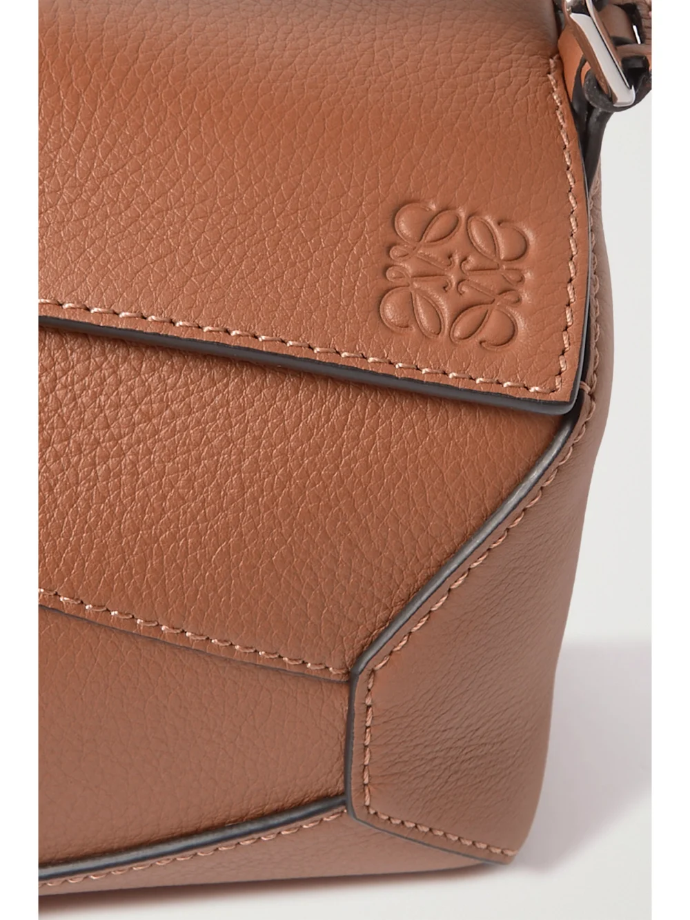 Close-up detail of the Loewe Puzzle Edge Mini Textured-leather Shoulder Bag