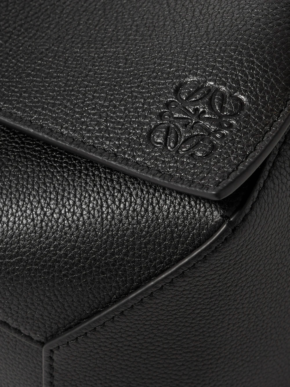Close-up detail of the Loewe Puzzle Edge Small Textured-leather Shoulder Bag