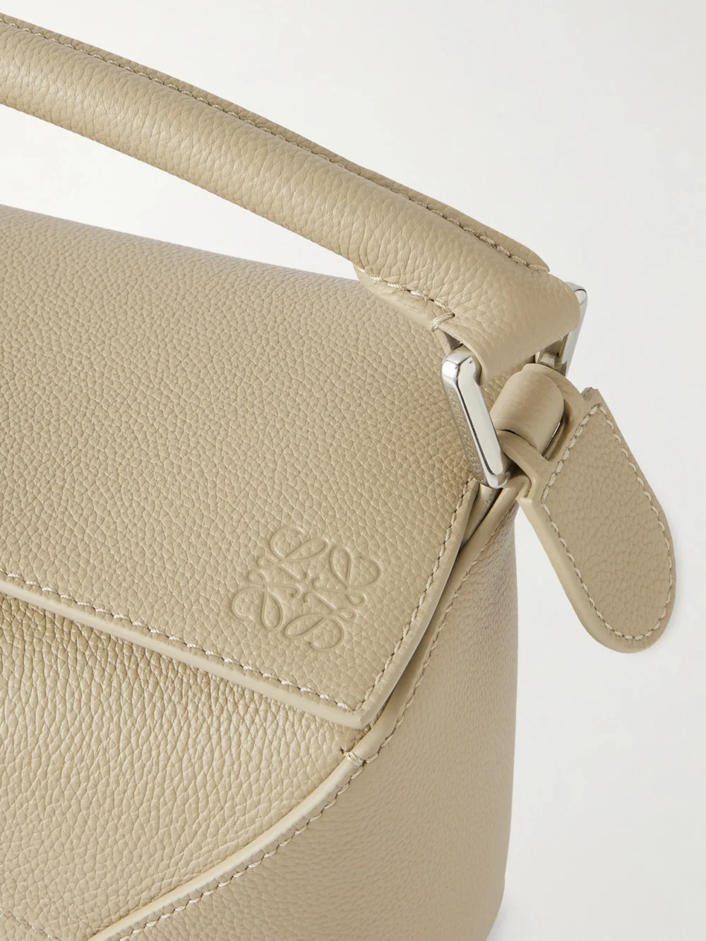 Close-up detail of the Loewe Puzzle Edge Small Textured-leather Shoulder Bag