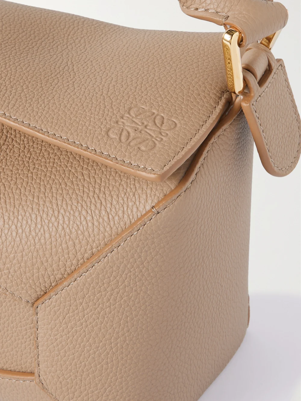 Close-up detail of the Loewe Puzzle Edge Small Textured-leather Shoulder Bag