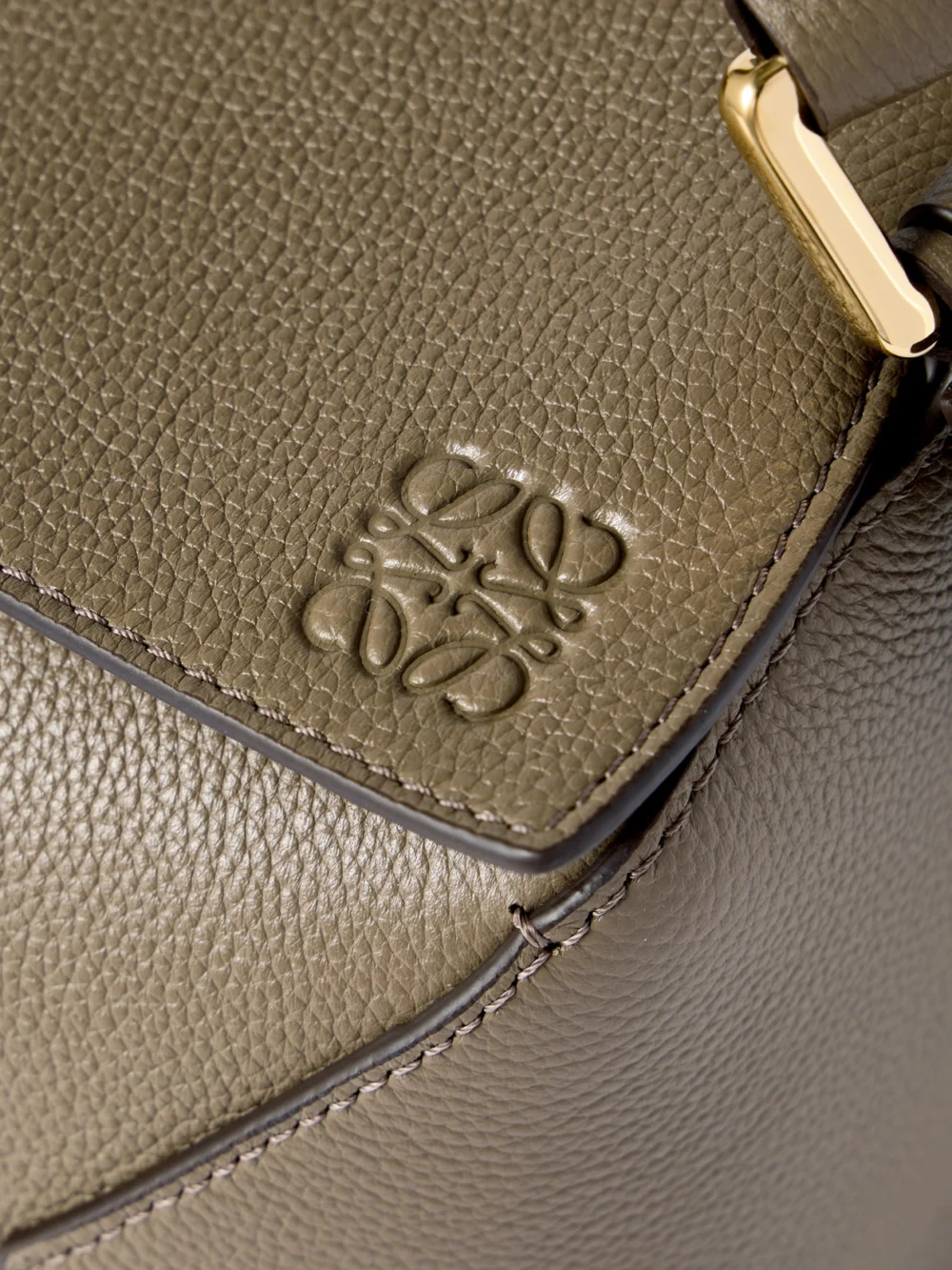 Close-up detail of the Loewe Puzzle Edge Small Textured-leather Shoulder Bag