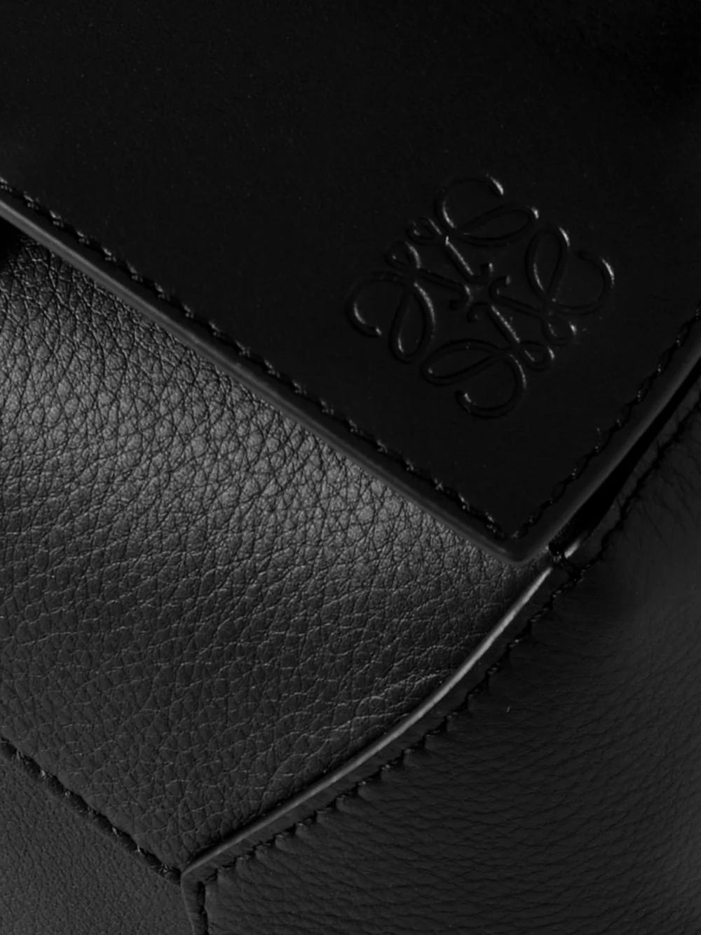 Close-up detail of the Loewe Puzzle Edge Small Textured-leather Top-handle Bag