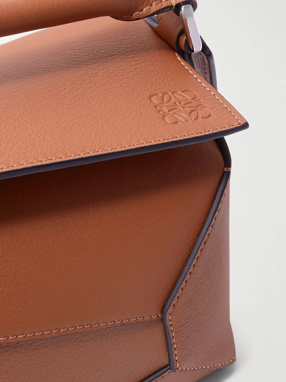 Close-up detail of the Loewe Puzzle Edge Small Textured-leather Top-handle Bag