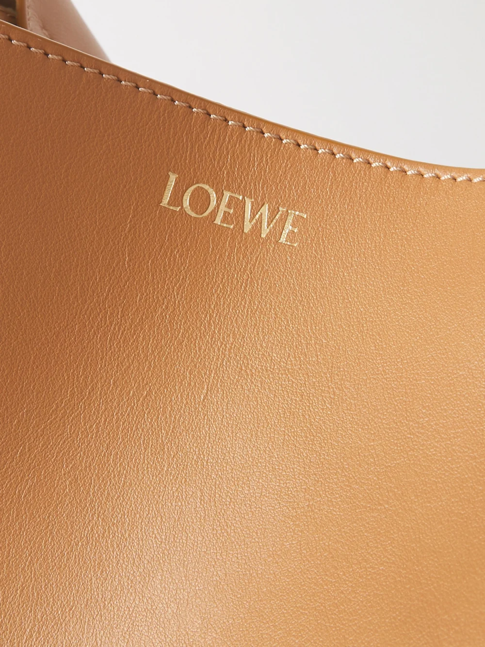 Close-up detail of the Loewe Puzzle Fold Convertible Medium Leather Tote