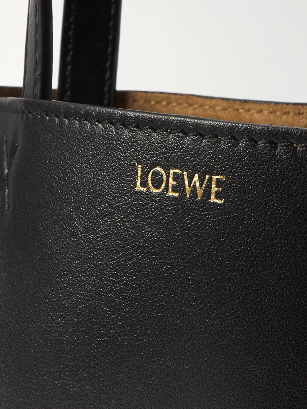 Close-up detail of the Loewe Puzzle Fold Convertible Mini Leather Tote