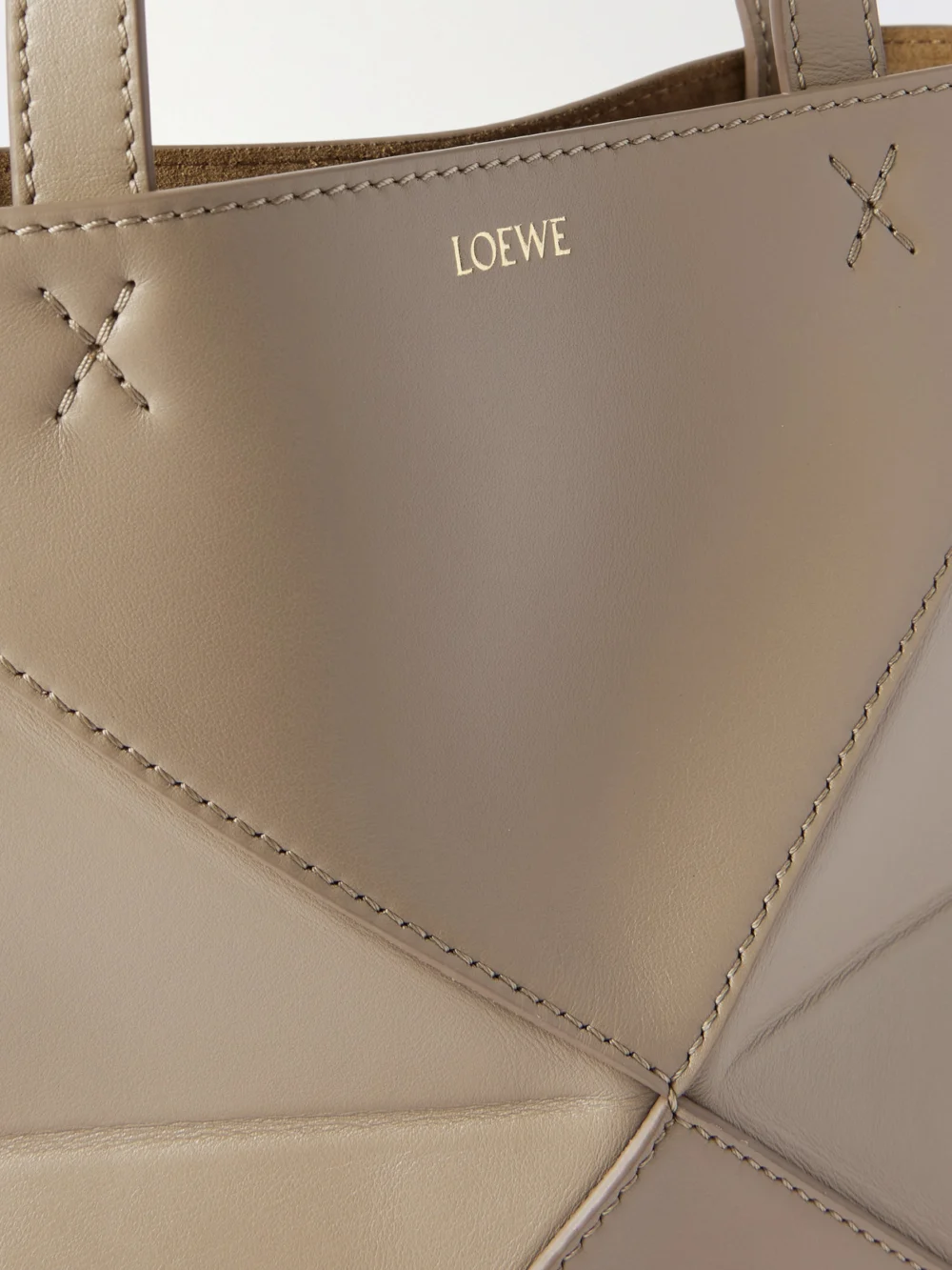 Close-up detail of the Loewe Puzzle Fold Convertible Mini Leather Tote