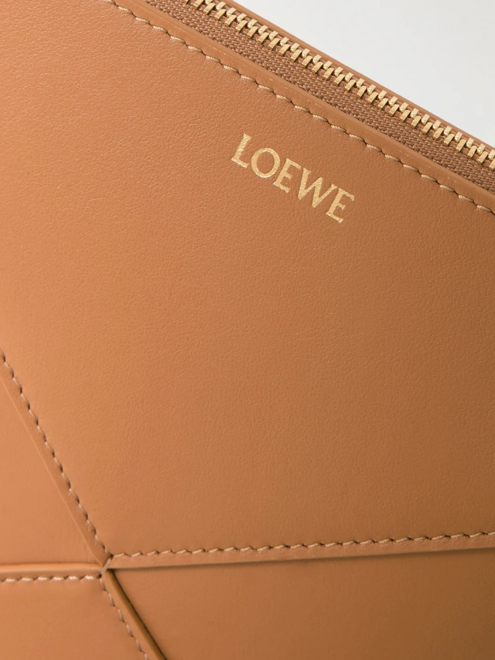 Close-up detail of the Loewe Puzzle Fold Leather Clutch