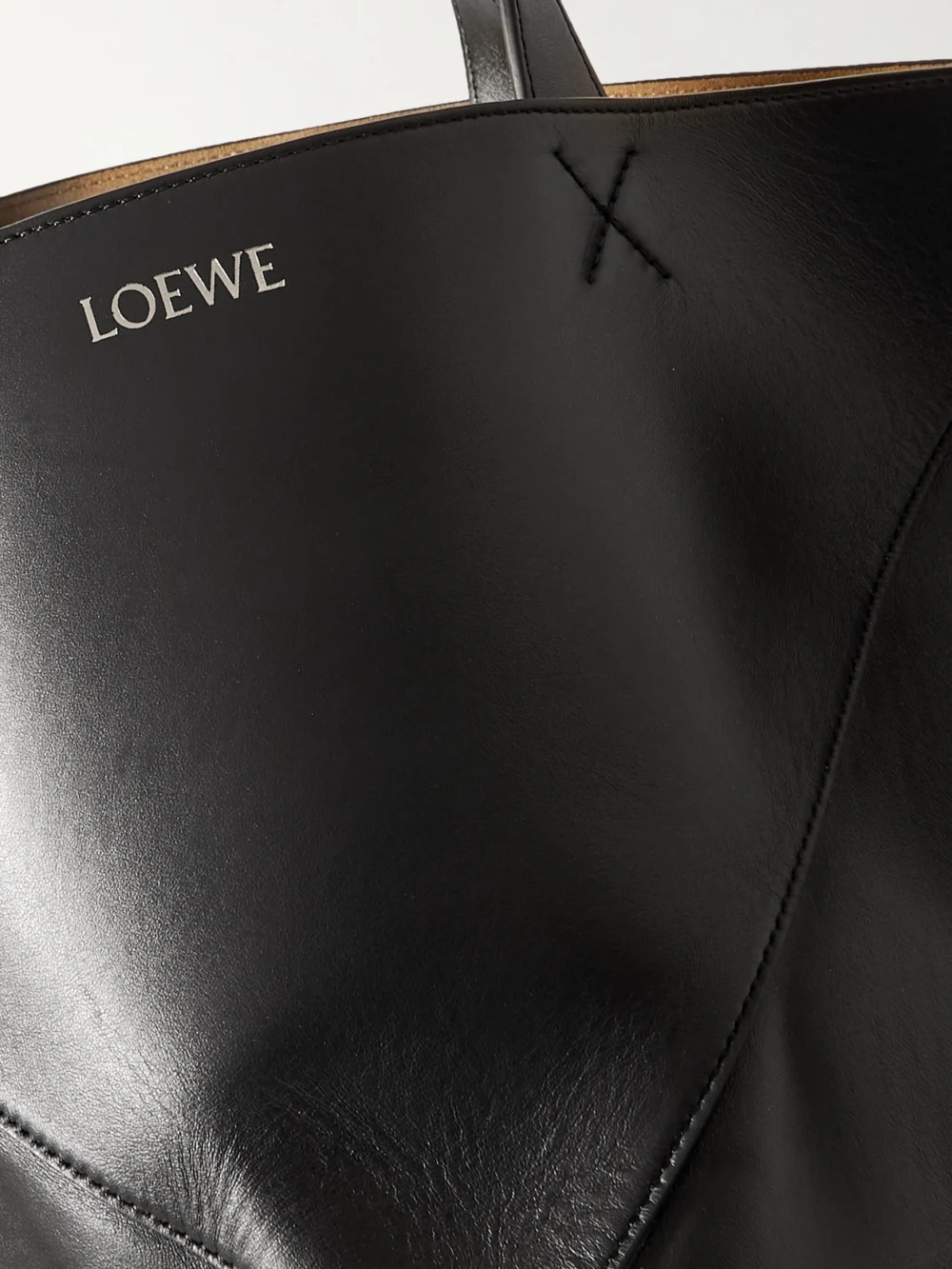Close-up detail of the Loewe Puzzle Fold Xl Convertible Leather Tote