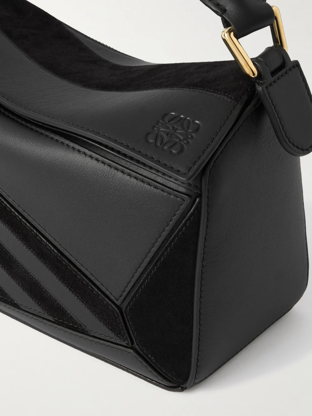Close-up detail of the Loewe Puzzle Small Suede-trimmed Leather Top-handle Bag
