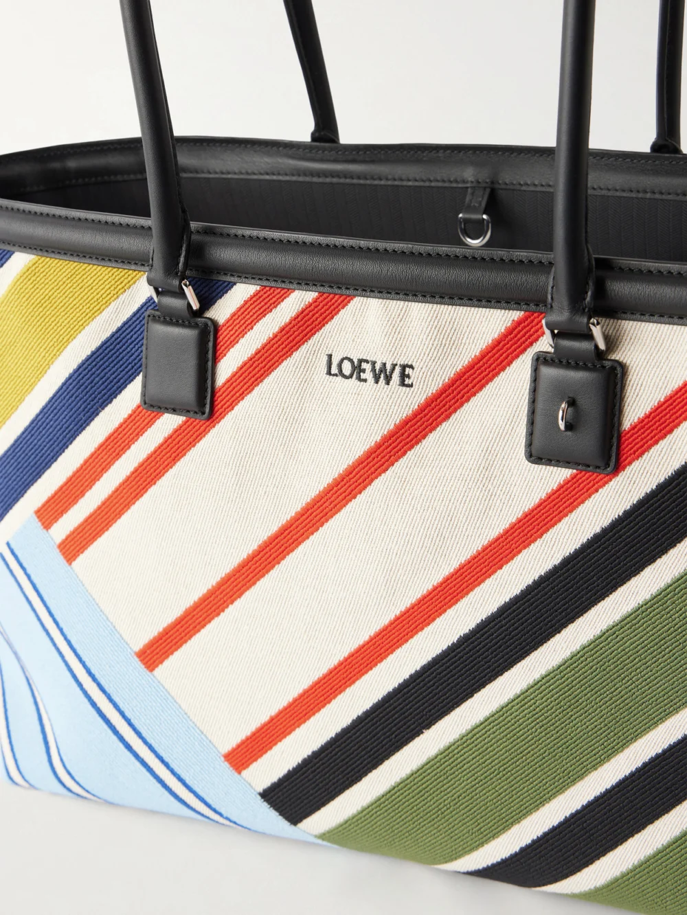 Close-up detail of the Loewe Verano Logo-embroidered Striped Leather-trimmed Canvas Tote