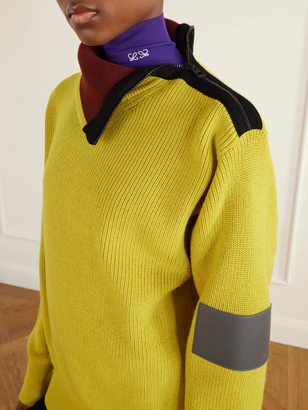 Close-up detail of the Loewe Zip-detailed Leather-trimmed Ribbed Wool-blend Turtleneck Sweater