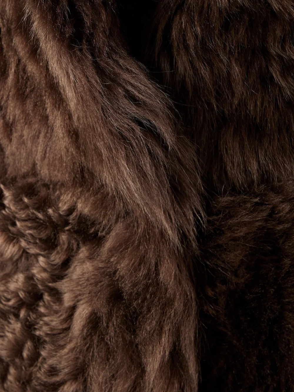 Close-up detail of the Loro Piana Ardis Reversible Belted Shearling and Suede Vest