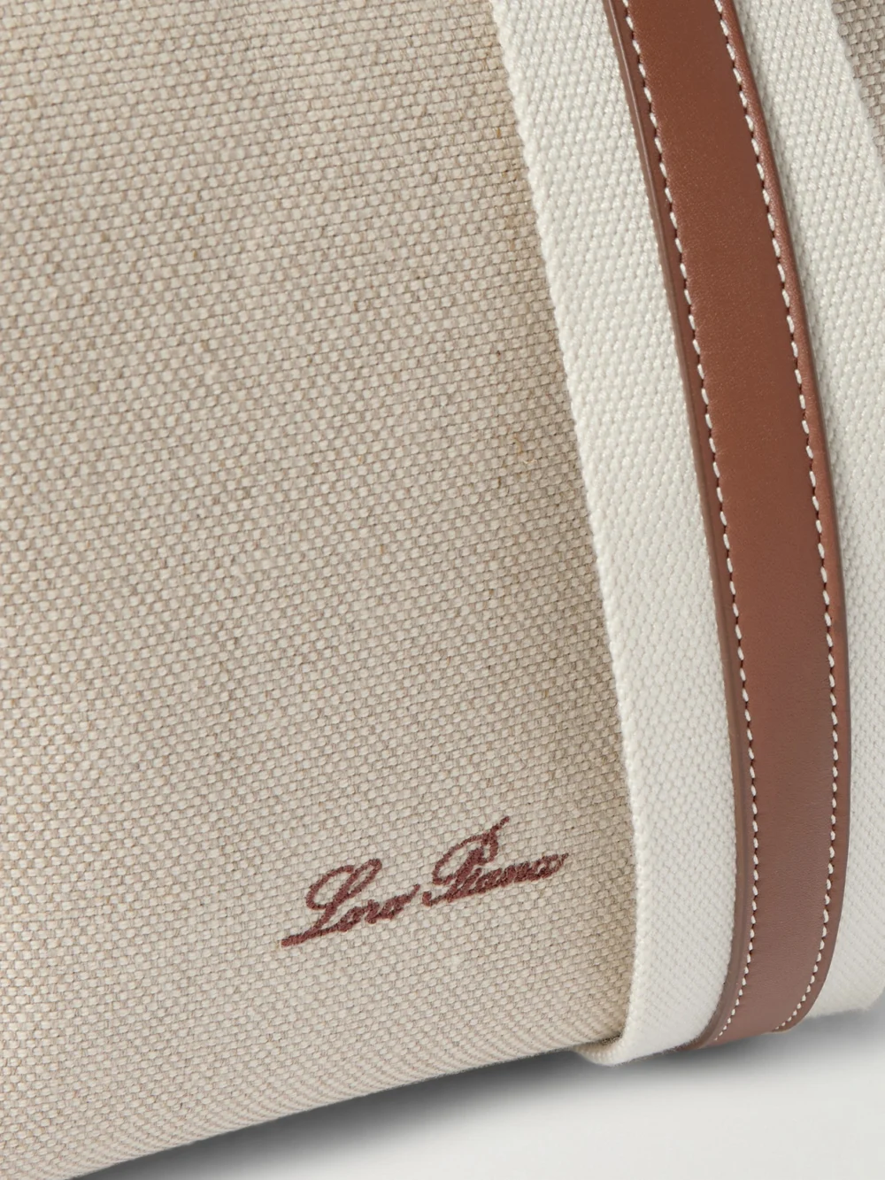 Close-up detail of the Loro Piana Bale Textured Leather-trimmed Canvas Tote