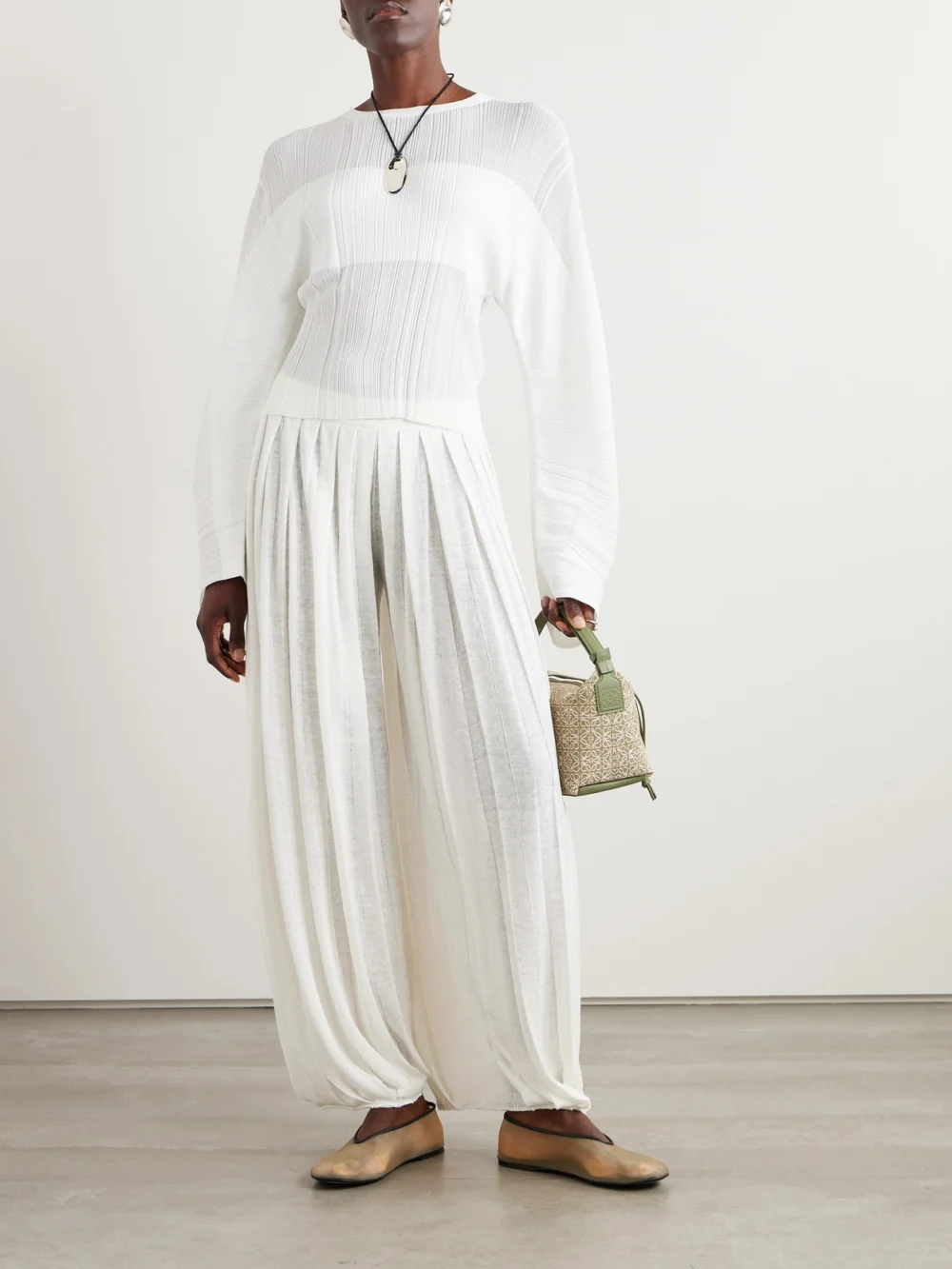 Loro Piana Balloon Pleated Linen Pants, worn by a model
