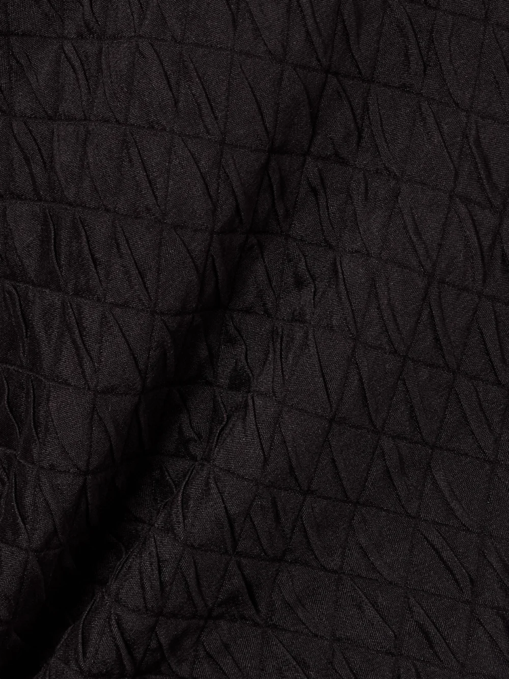 Close-up detail of the Loro Piana Elise Quilted Silk-cloqué Midi Skirt