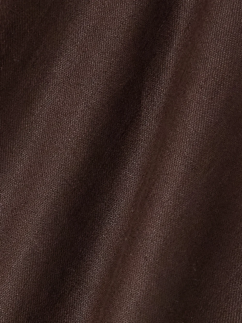 Close-up detail of the Loro Piana Gaia Asymmetric Linen Blouse