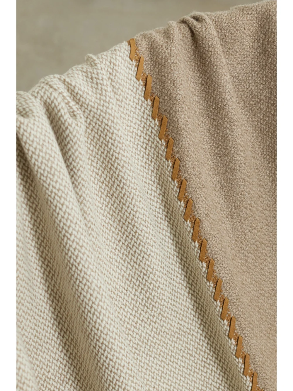 Close-up detail of the Loro Piana Gobi Suede-trimmed Fringed Color-block Cashmere Throw