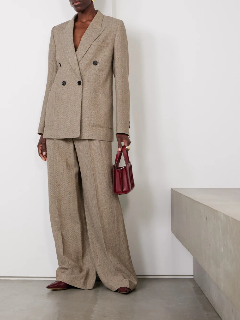 Loro Piana Nyack Pleated Herringbone Linen Wide-leg Pants, worn by a model