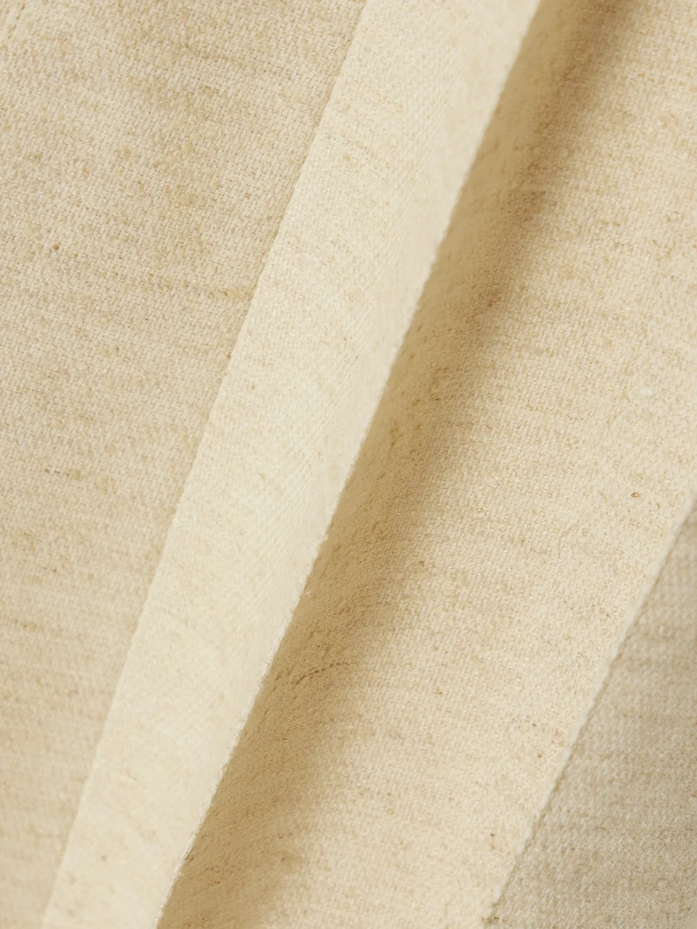 Close-up detail of the Loro Piana Pleated Woven Midi Skirt