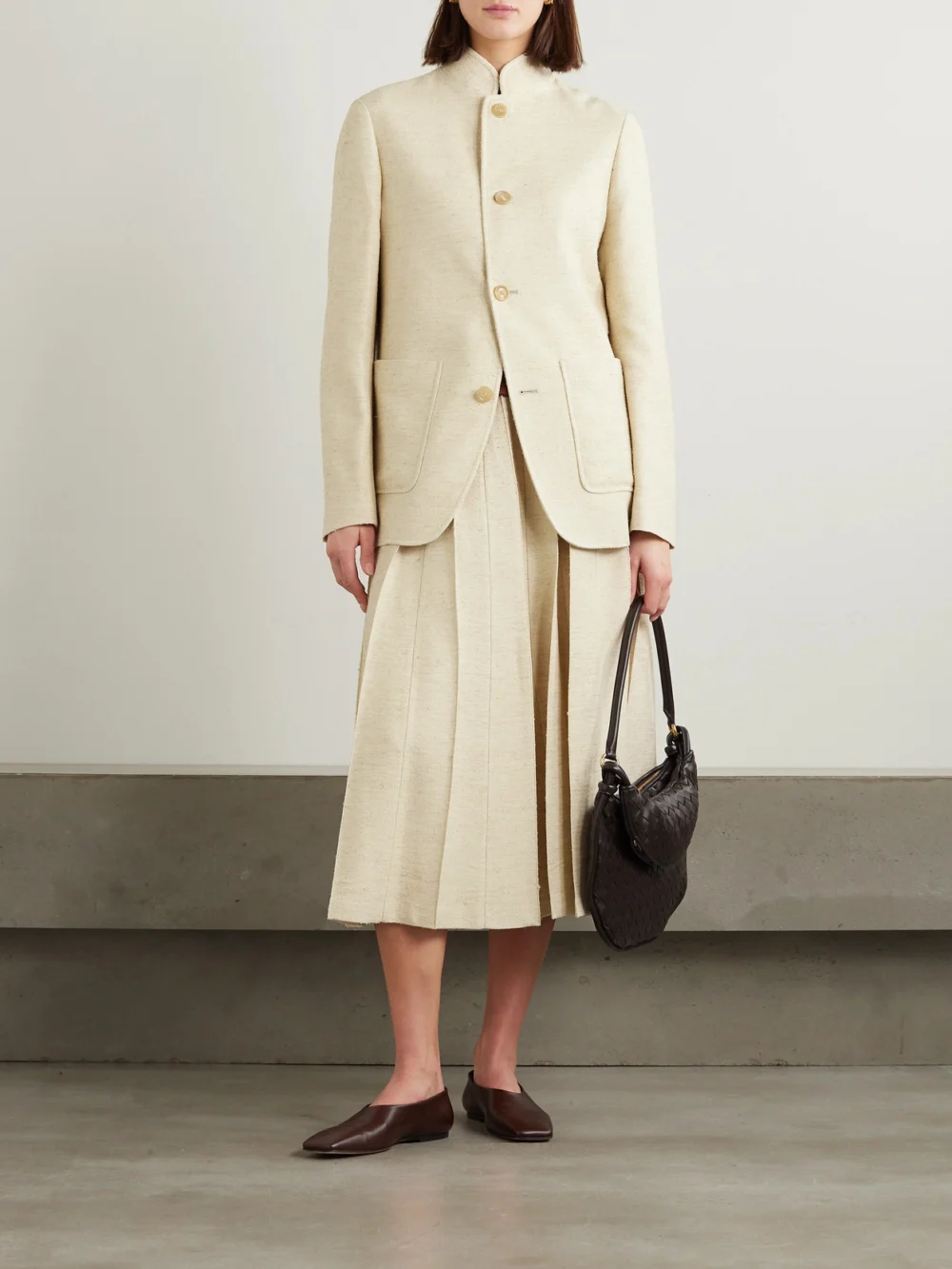 Loro Piana Pleated Woven Midi Skirt, worn by a model