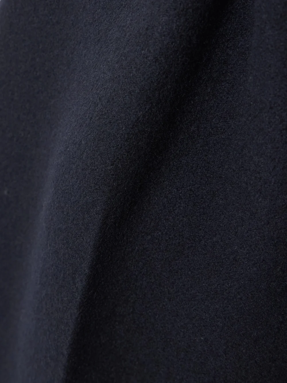 Close-up detail of the Loro Piana Ralph Pleated Cashmere Straight-leg Pants