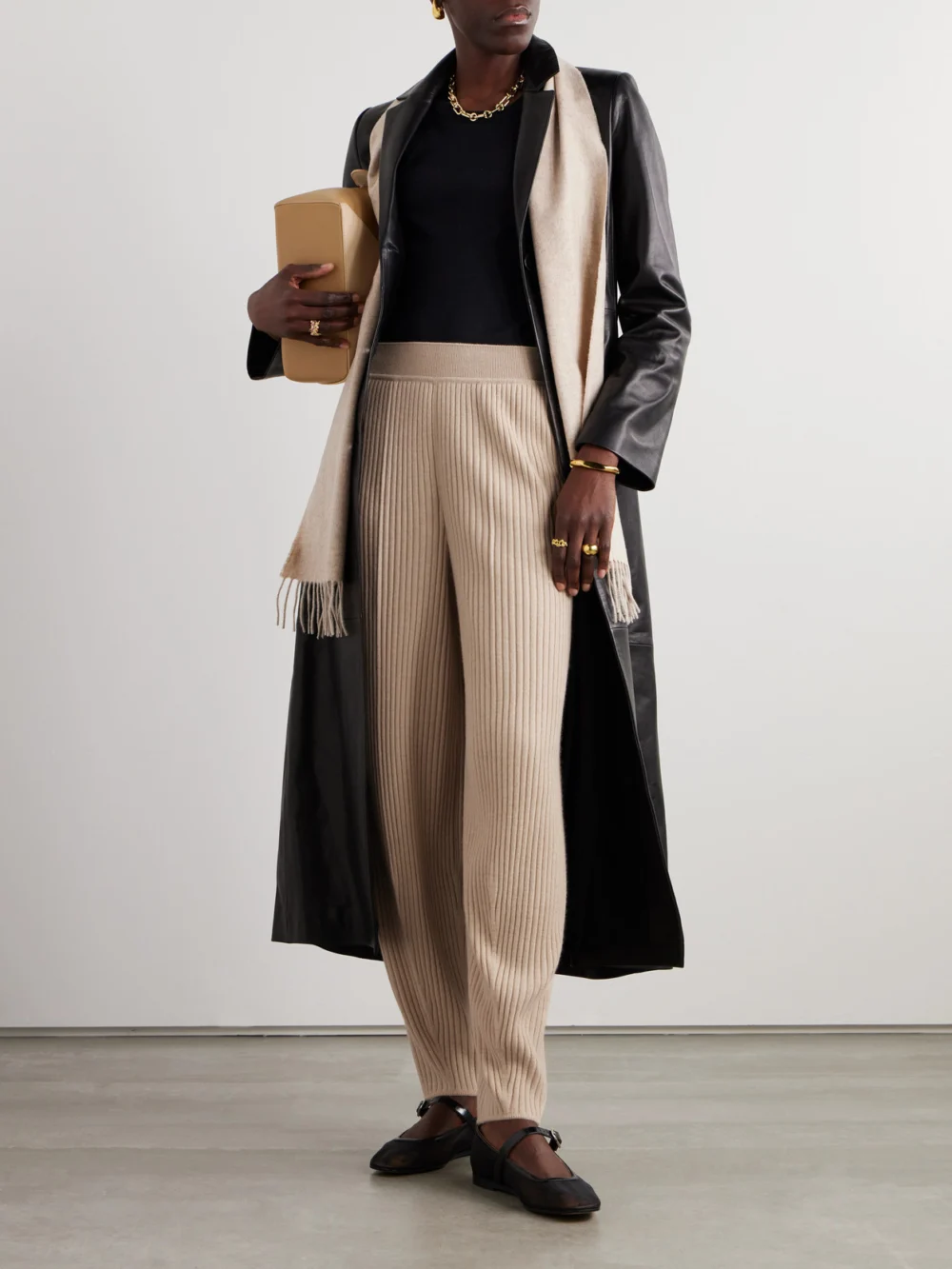 Loro Piana Ribbed Cashmere Tapered Pants, worn by a model