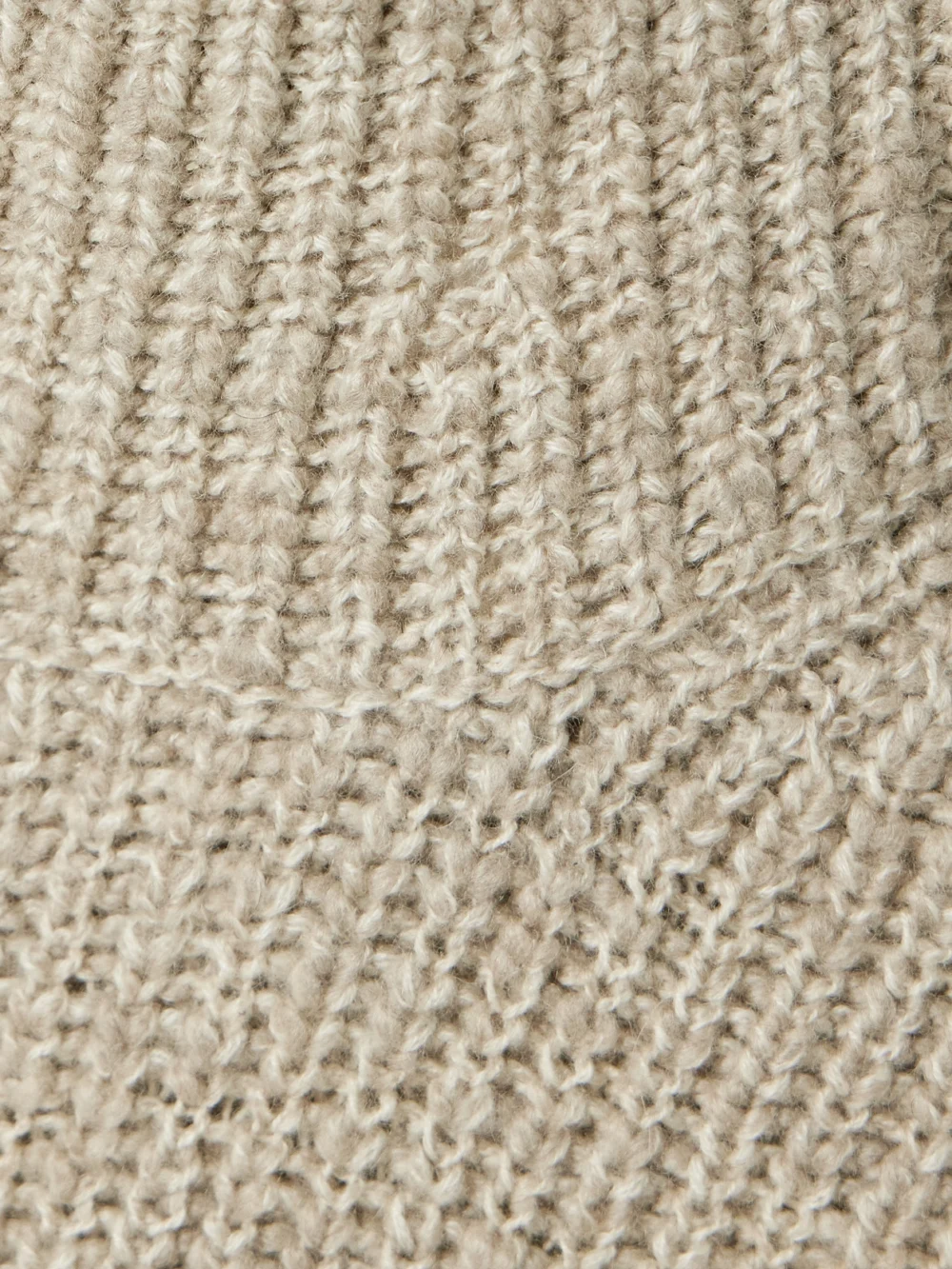 Close-up detail of the Loro Piana Ribbed Cashmere Turtleneck Sweater