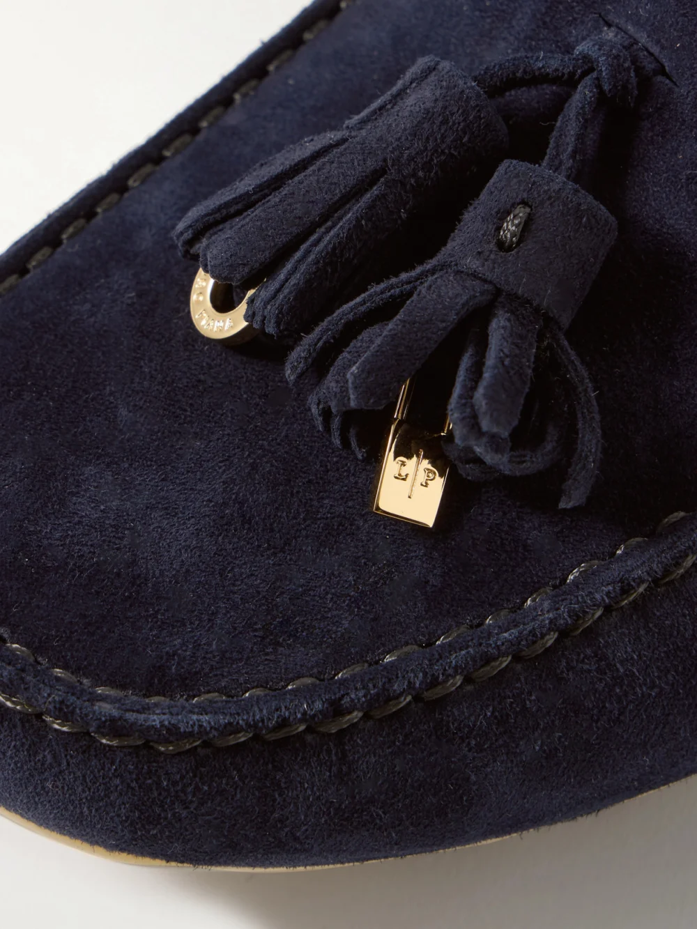 Close-up detail of the Loro Piana Tasseled Suede Collapsible-heel Loafers