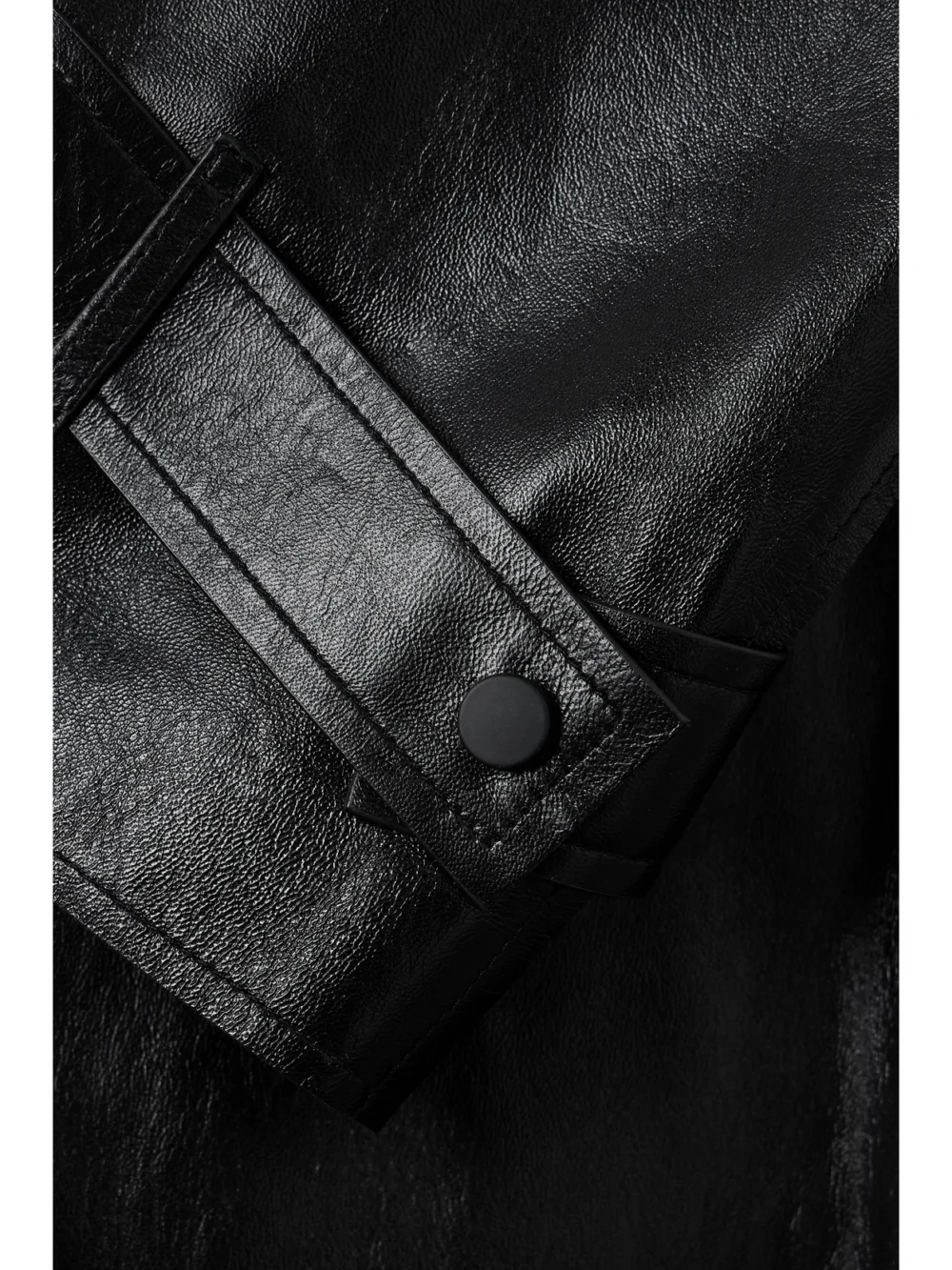 Close-up detail of the Mackage Adriana Double-breasted Belted Leather Trench Coat