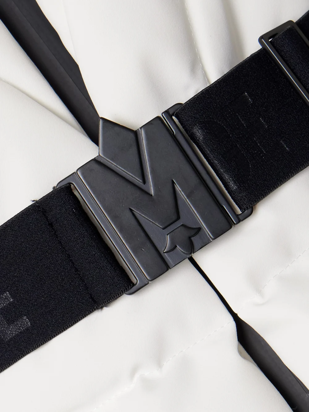 Close-up detail of the Mackage Elita Hooded Belted Quilted Down Ski Jacket