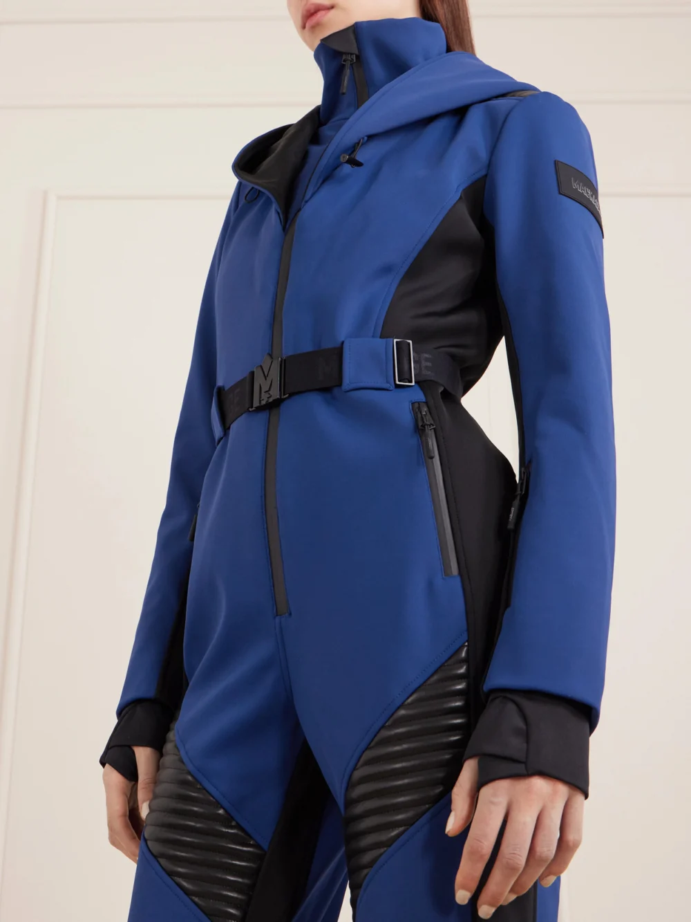 Close-up detail of the Mackage Elle Belted Hooded Ski Suit