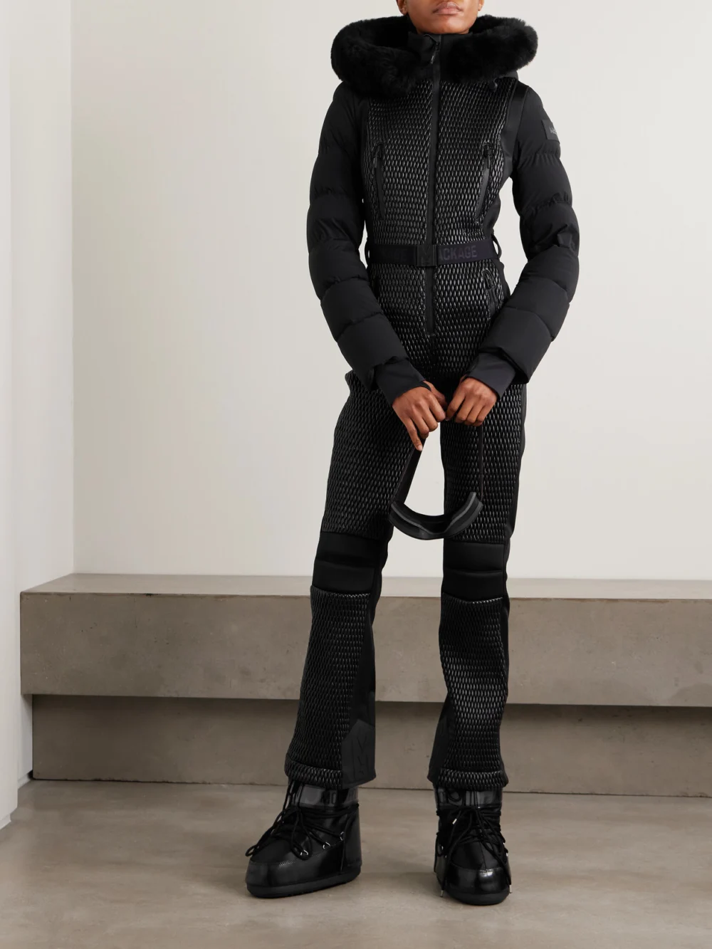 Mackage Lorelle Belted Hooded Plush-trimmed Quilted Padded Down Ski Suit, worn by a model