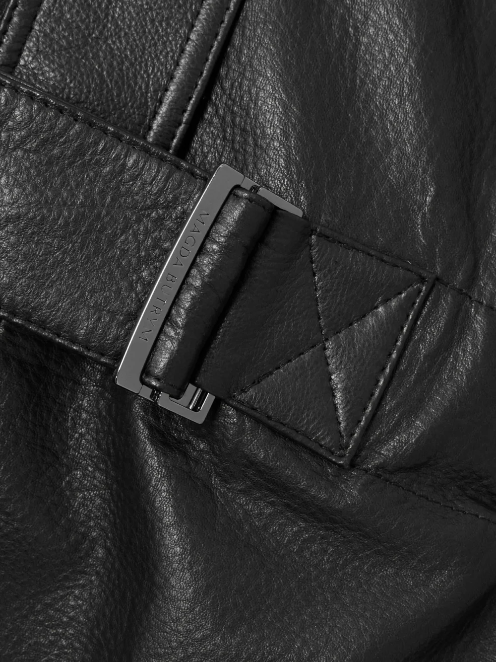 Close-up detail of the Magda Butrym Belted Leather Playsuit