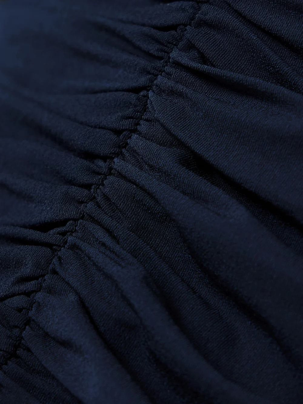 Close-up detail of the Magda Butrym Off-the-shoulder Ruched Jersey Dress