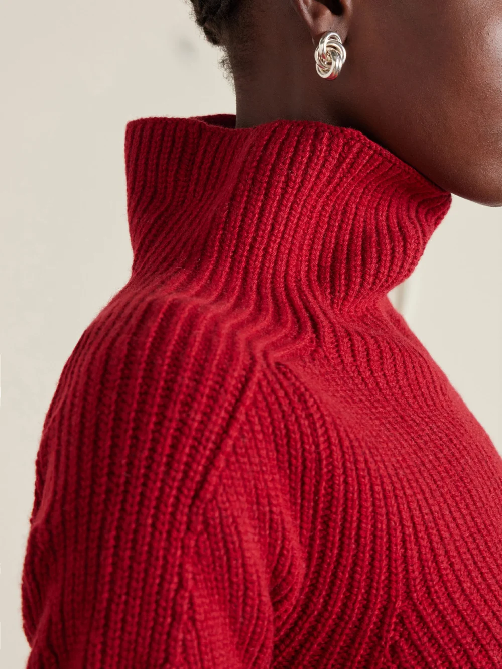 Close-up detail of the Magda Butrym Ribbed Cashmere Turtleneck Mini Dress