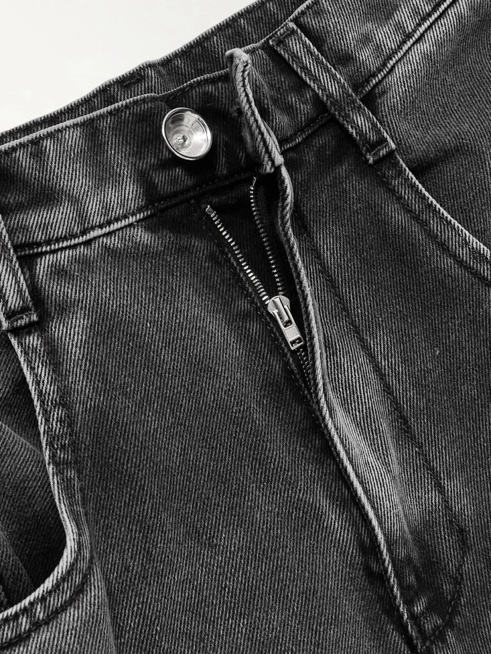 Close-up detail of the Maison Margiela Cutout High-rise Wide-leg Jeans