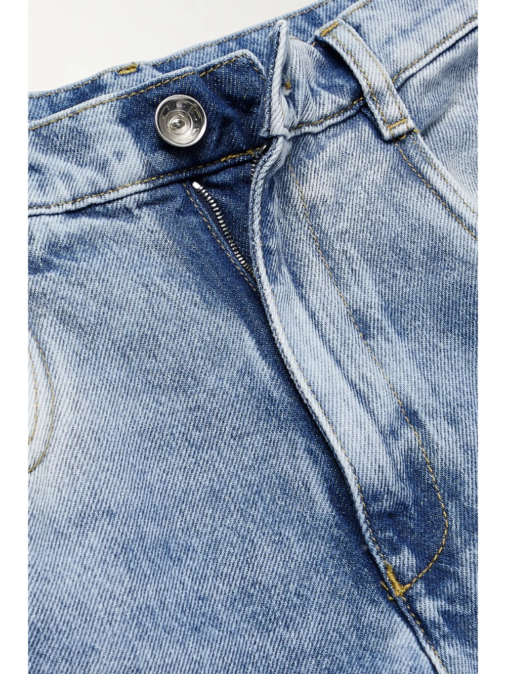 Close-up detail of the Maison Margiela Cutout High-rise Wide-leg Jeans