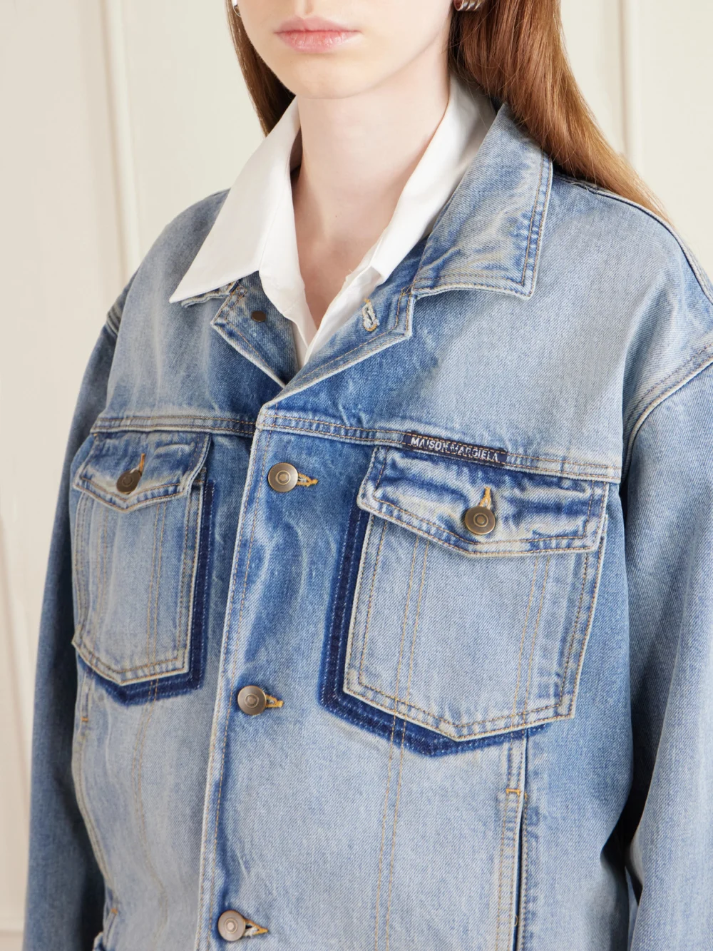 Close-up detail of the Maison Margiela Distressed Denim Jacket