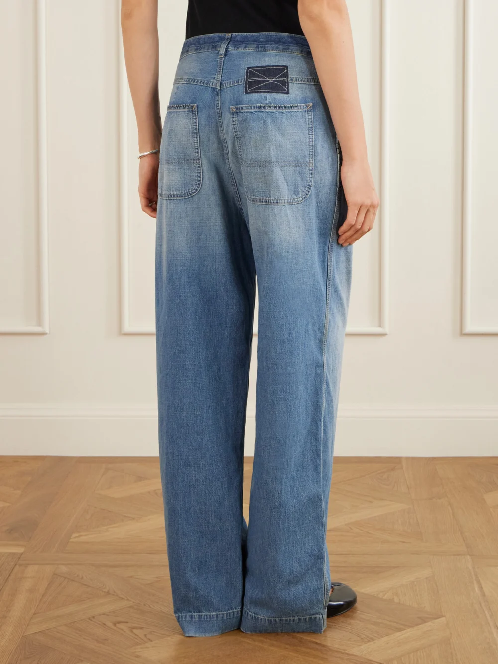 Back view of the Maison Margiela Distressed Mid-rise Wide-leg Jeans