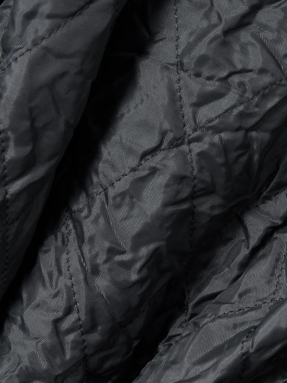 Close-up detail of the Maison Margiela Padded Wool-trimmed Quilted Crinkled Shell Jacket