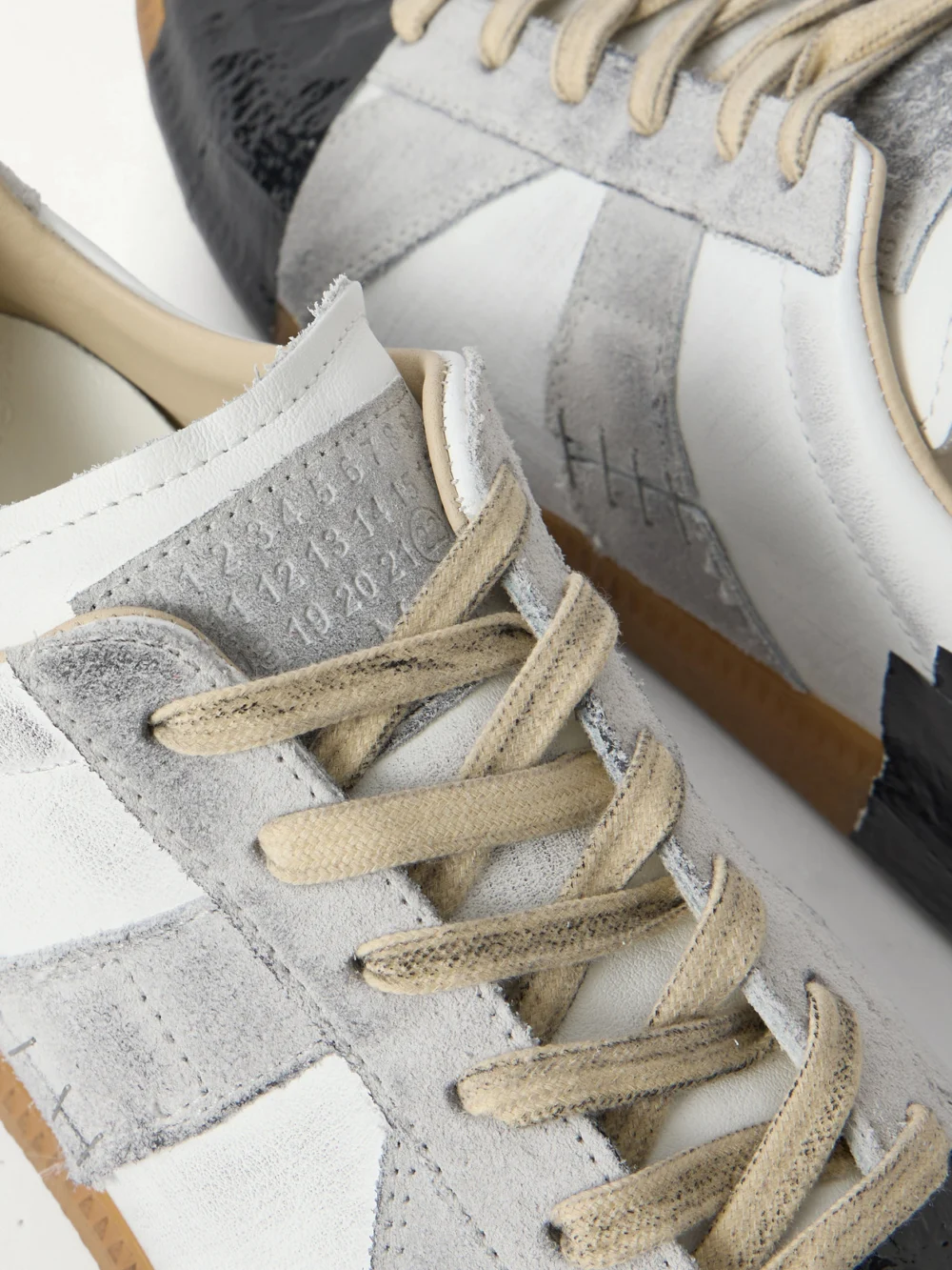 Close-up detail of the Maison Margiela Replica Leather and Suede Sneakers