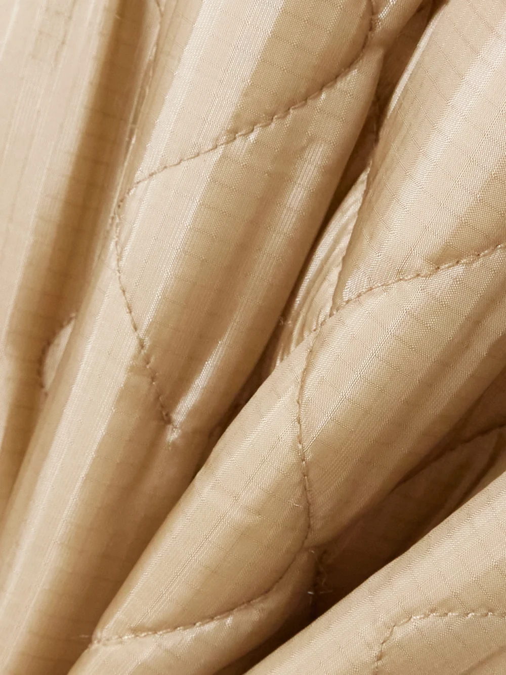 Close-up detail of the Maison Margiela Reversible Quilted Shell and Ribbed Cotton Jacket