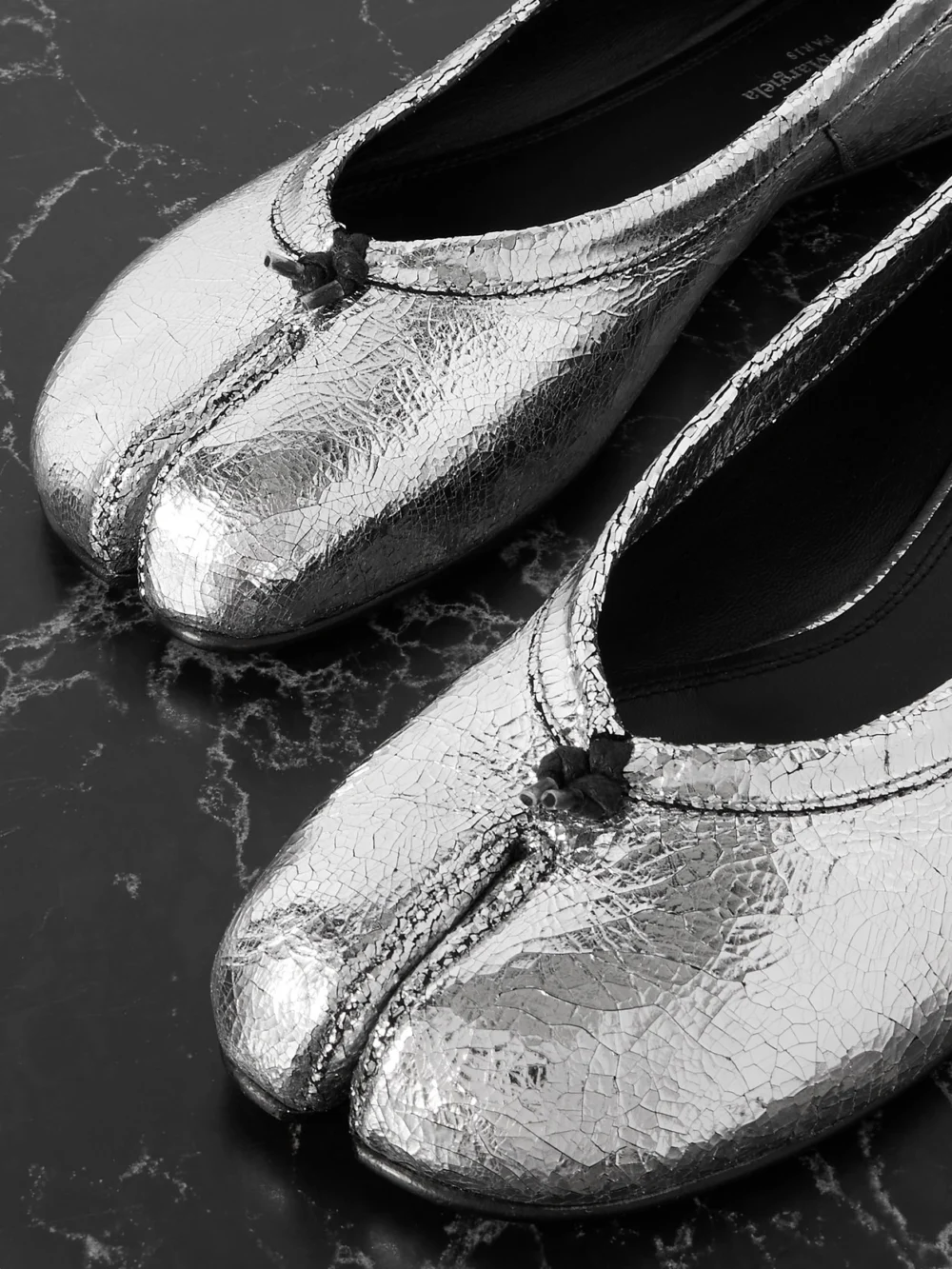 Close-up detail of the Maison Margiela Tabi Metallic Cracked-leather Ballet Flats