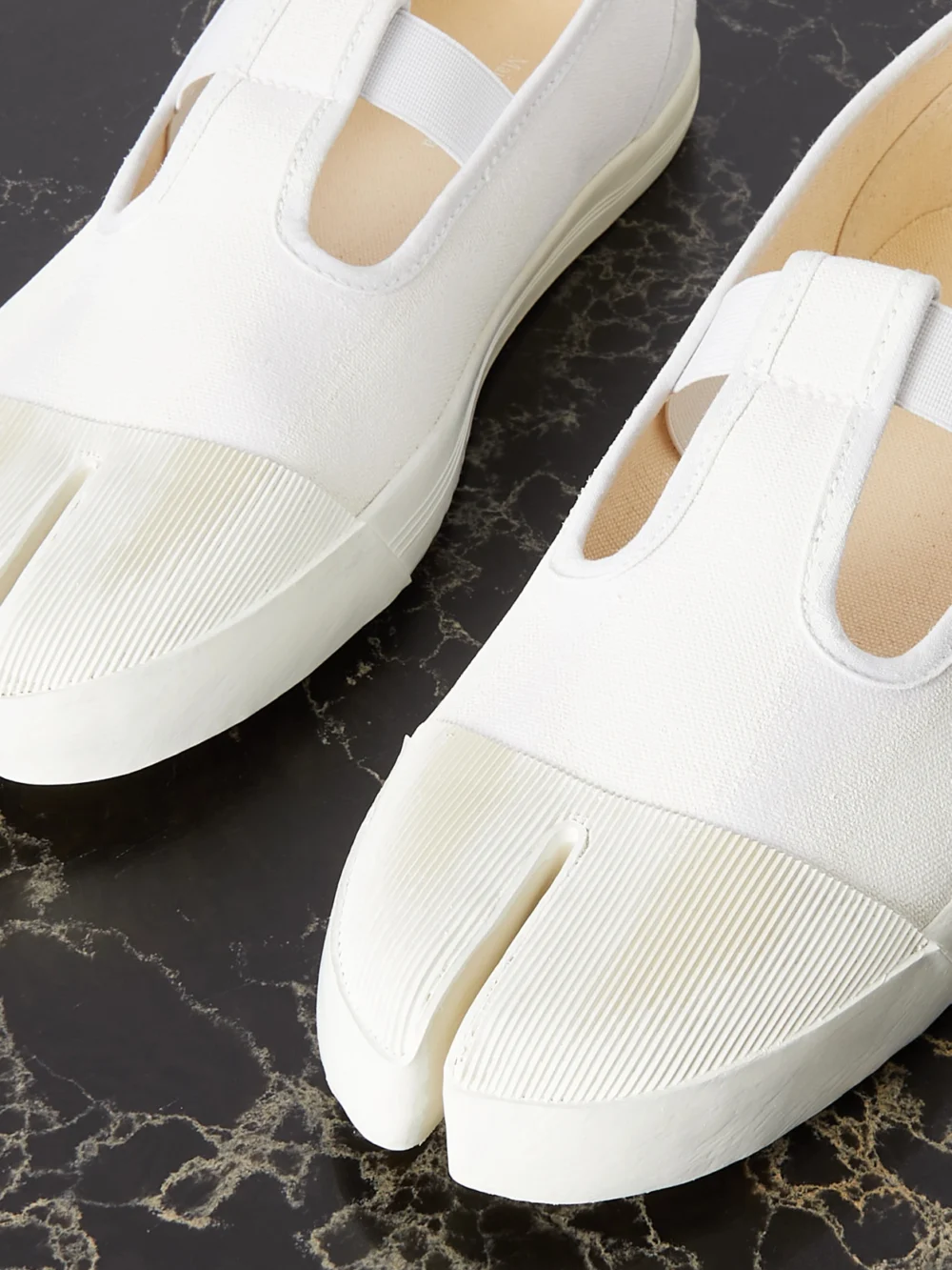 Close-up detail of the Maison Margiela Tabi on the Deck Distressed Canvas Sneakers