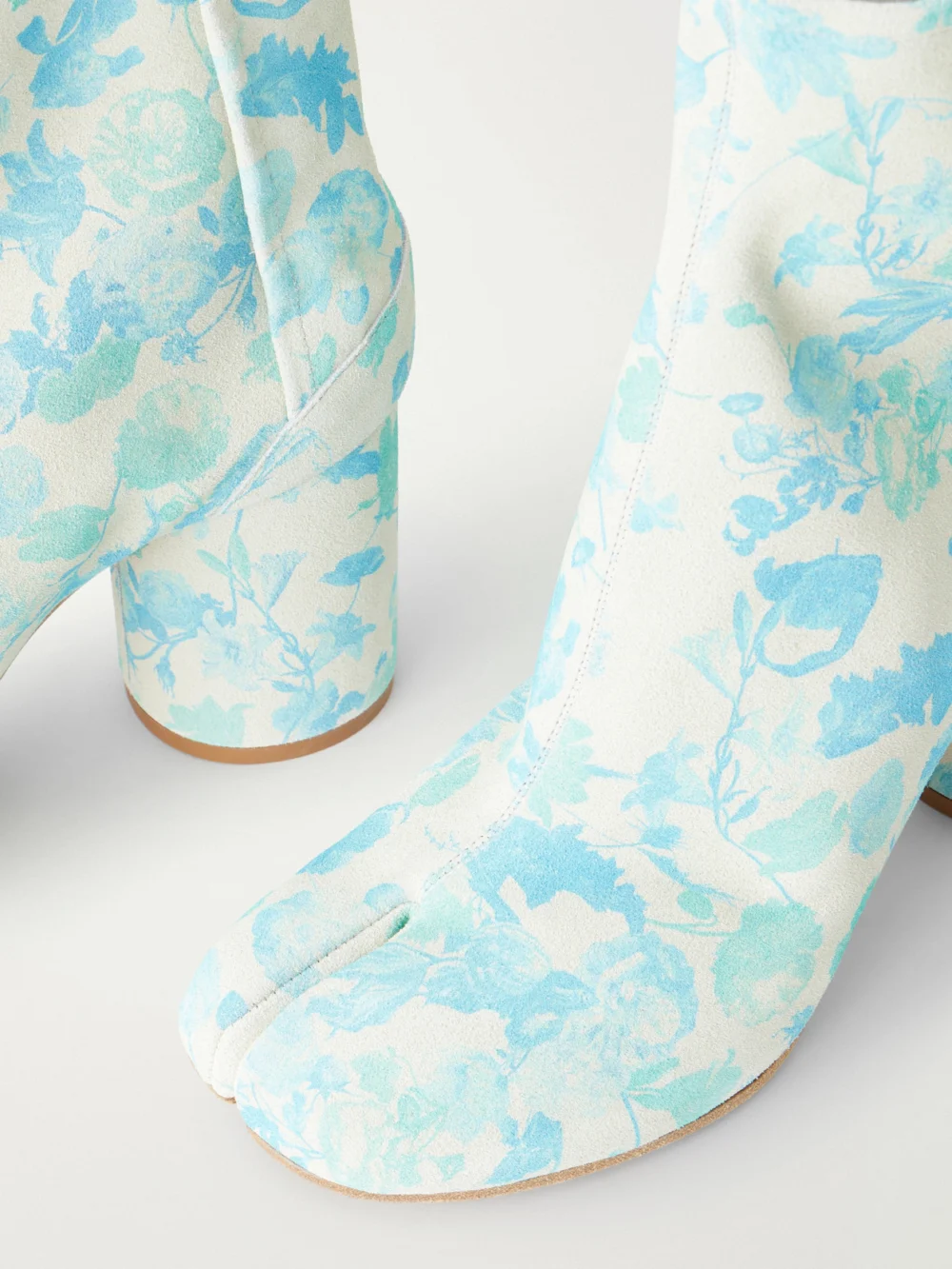 Close-up detail of the Maison Margiela Tabi Split-toe Floral-print Suede Ankle Boots