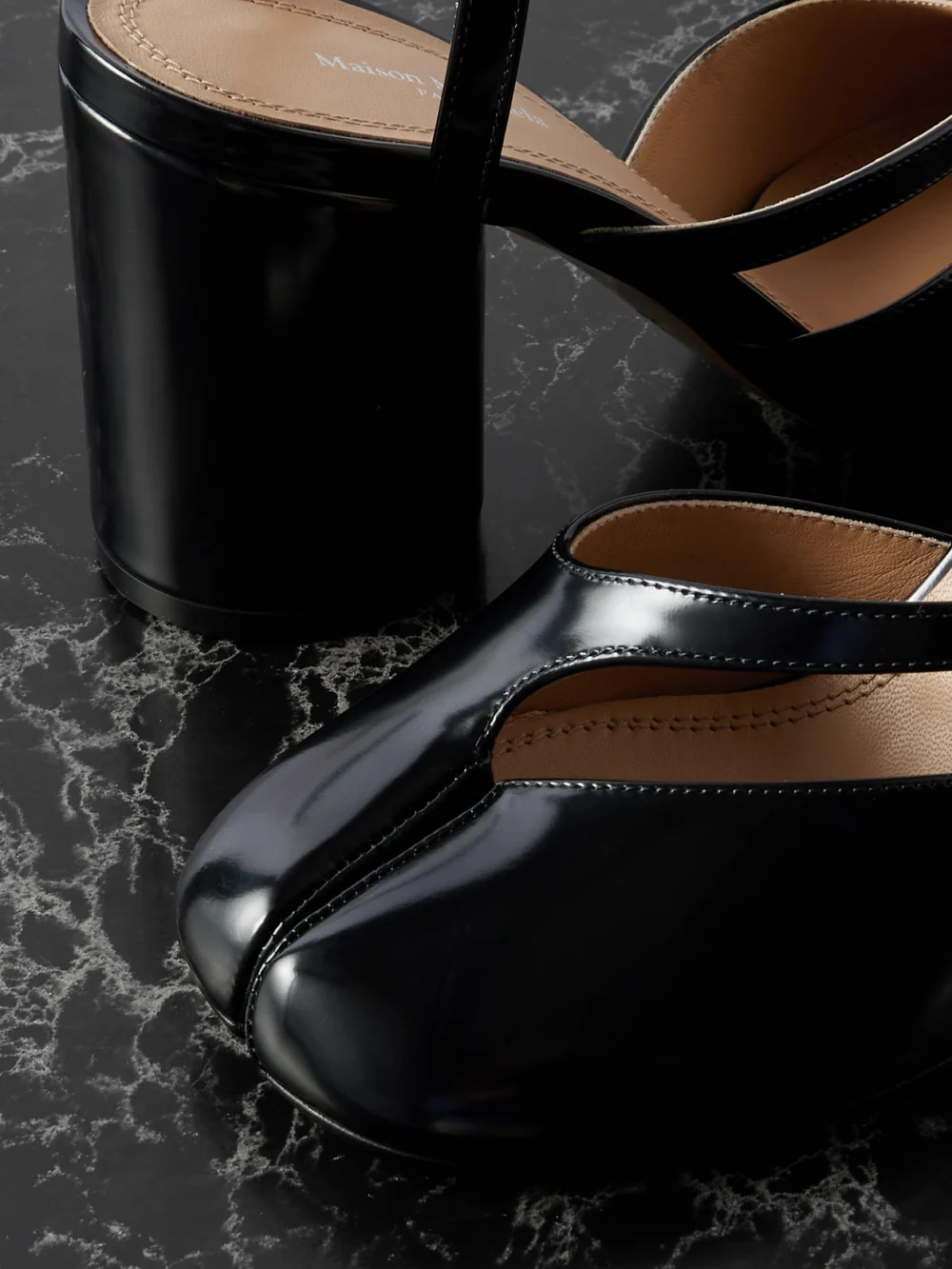 Close-up detail of the Maison Margiela Tabi Split-toe Glossed Leather Pumps