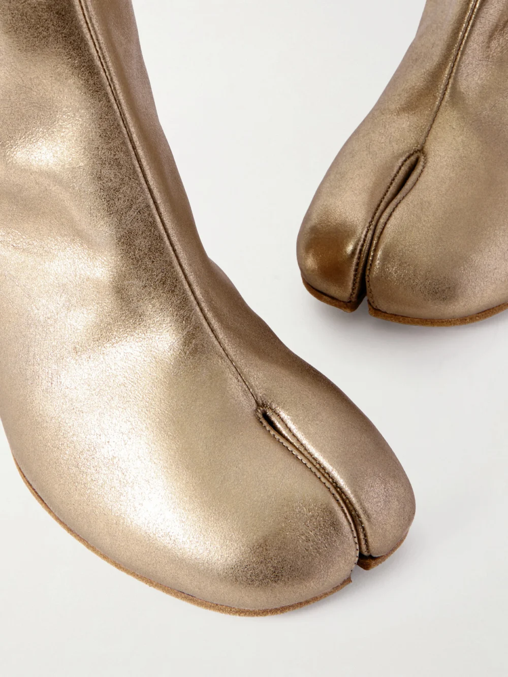 Close-up detail of the Maison Margiela Tabi Split-toe Metallic Leather Ankle Boots