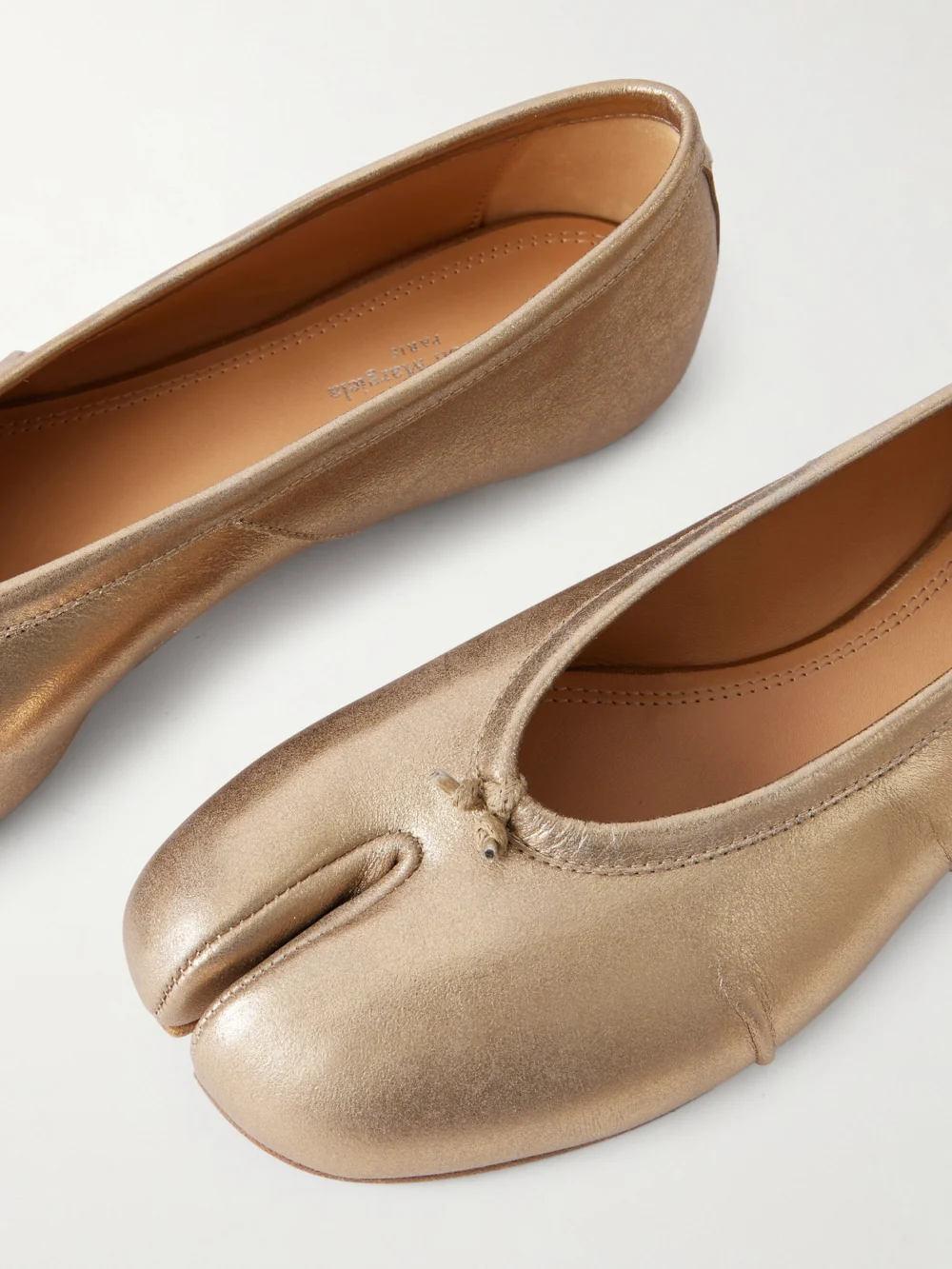 Close-up detail of the Maison Margiela Tabi Split-toe Textured Metallic Leather Ballet Flats