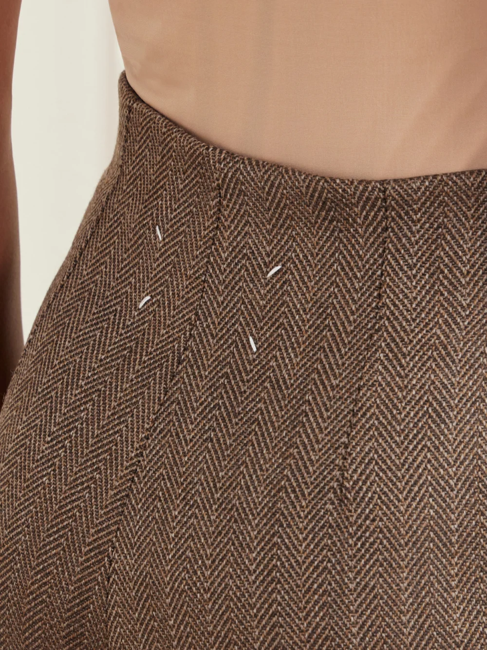 Close-up detail of the Maison Margiela Wool-herringbone Midi Skirt